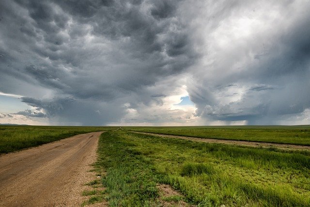 road with dark clouds